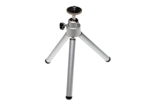 Beyaz Zemin Üzerinde Küçük Bir Kamera Tripod — Stok fotoğraf