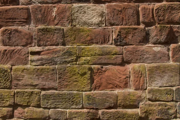 Стіна Побудована Червоного Вирізаного Пісковика Кривими Текстурами Тримаються Разом Точкою — стокове фото