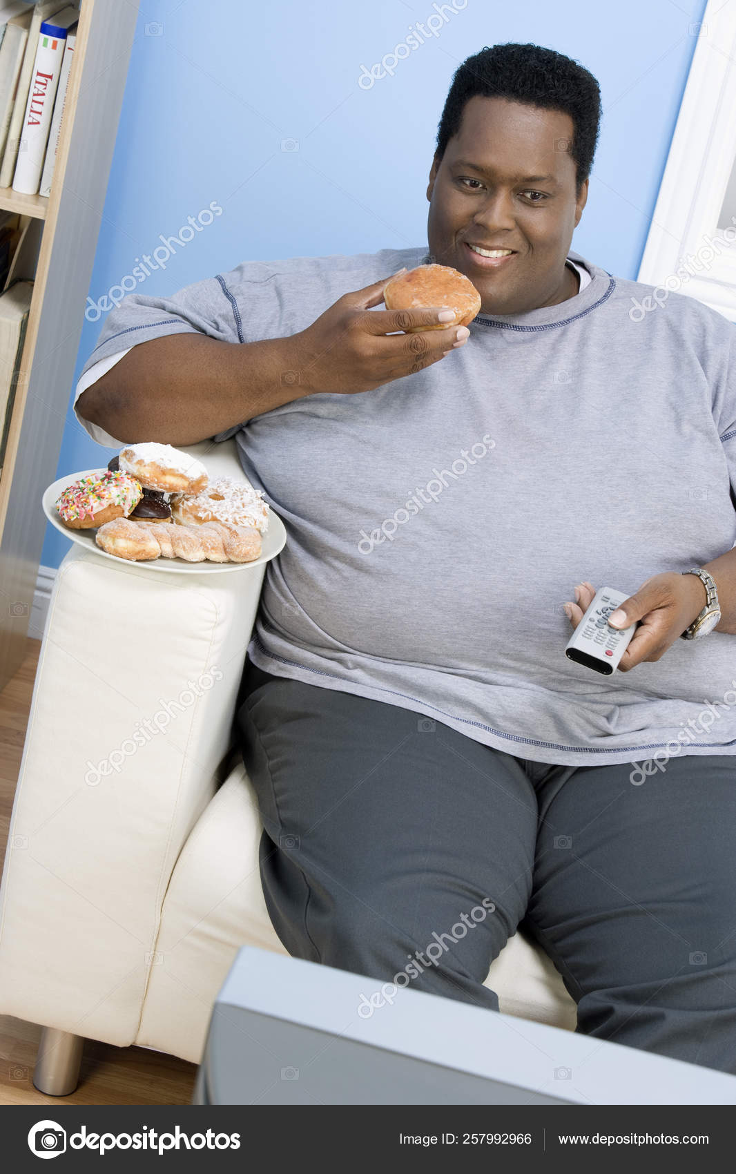 Hombre Obeso Comiendo Donut: fotografía de stock © YAYImages #257992966