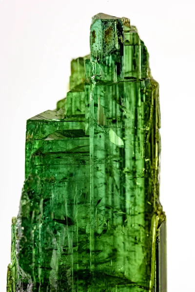 Detail of brazilian green tourmaline crystal with its texture, colors and transparency