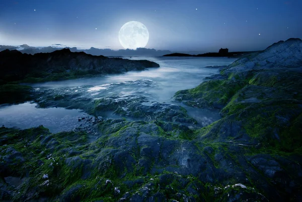 Full moon over the coast in Cornwall, UK