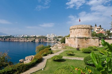 The old Hidirlik Tower watches over Antalya's harbour. clipart