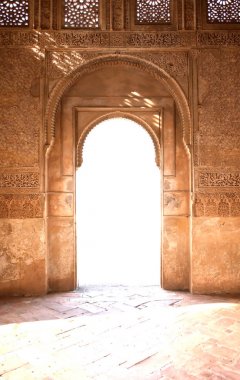 Nice arch door in ancient Arabian palace Alhambra. Granada, Spain clipart