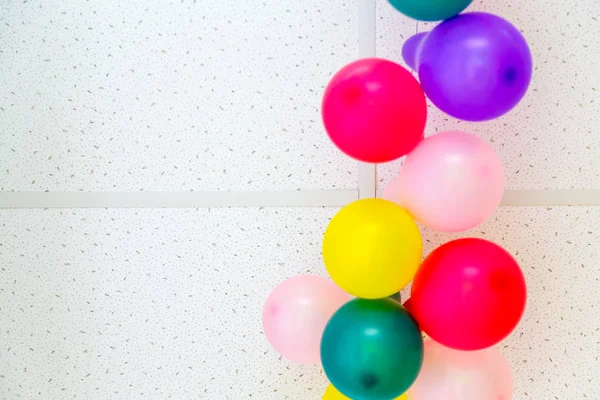 Colorful bunch of balloons hanging from ceiling