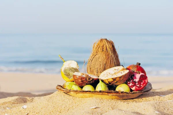 Fruits on the sandy beach at the sea