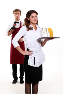 Waiter and waitress with a drinks tray clipart