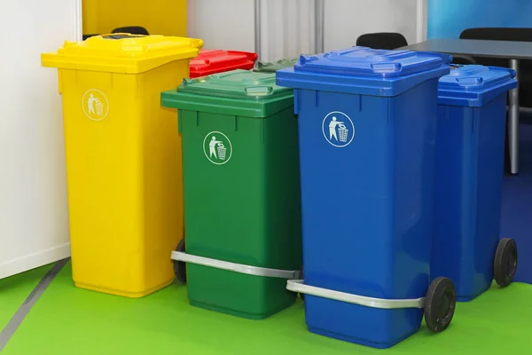 Three new plastic recycling bins for sorting waste