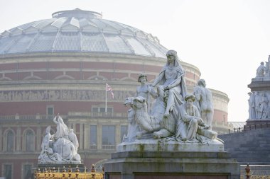 Albert Memorial statue overlooking hazy Royal Albert Hall, in London. The concert hall is home to the Proms, which take place each summer since 1941. clipart
