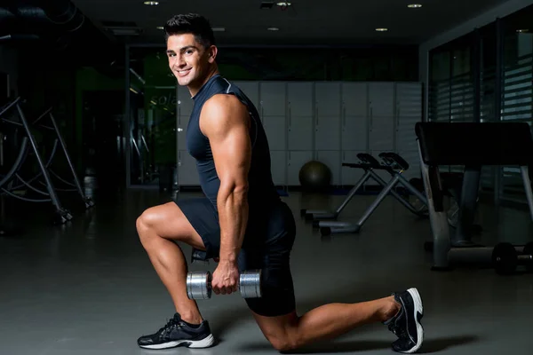 Dumbbell Lunge, man working out in gym