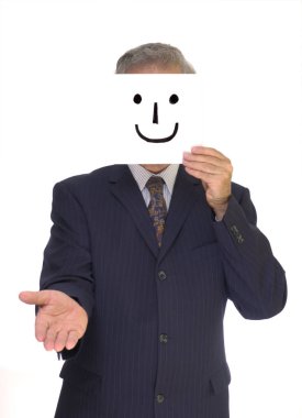 A pinstripe-suited businessman hold out his hand for a handshake with a home-made smiley mask in front of his face. clipart