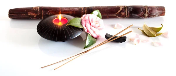 Incense and candle isolated on a white background