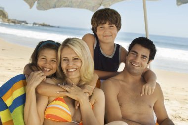 Happy Family On Beach Vacation clipart