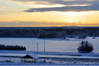 City of Fairbanks, Alaska at sunset in winter clipart