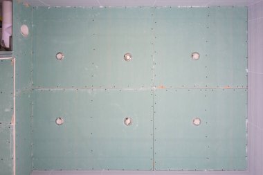 Ceiling of gipsokartonnyh sheets in the bath, spot lights are inserted clipart