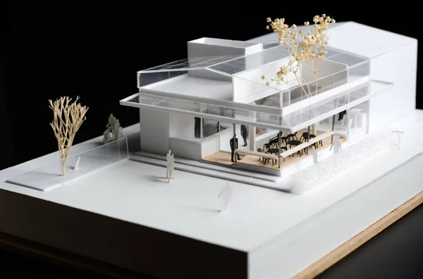 Architectural model of a modern building on black background