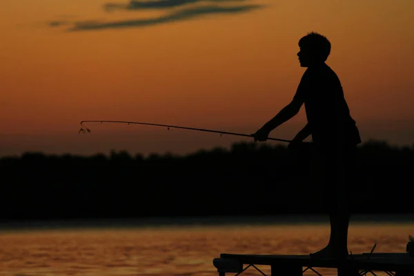 Silhouette Boy Fishing Pier Sunset — Stock Photo, Image