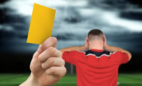 Hand Holding Yellow Card Football Pitch Stormy Sky Player — Stock Photo, Image