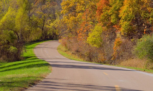 Curving road and autumn woods, Indian Cave State Park, Nebraska, USA