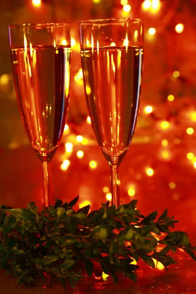 Champagne Glasses Green Box Twig Blured Lights Background — Stock Photo, Image