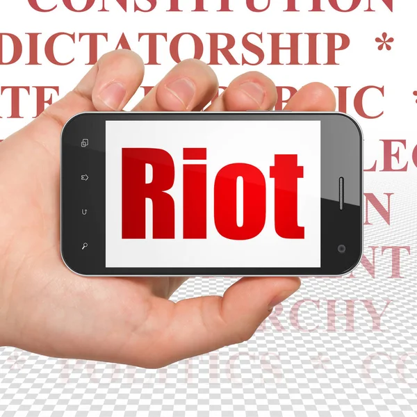 Politikai Koncepció Kéz Holding Smartphone Piros Szöveggel Riot Display Címkefelhő — Stock Fotó