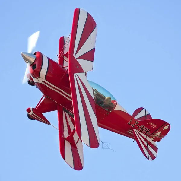 Red sport bi plane in action