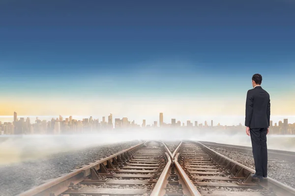 Businessman Turning His Back Camera Railway Tracks Leading City Horizon — Stock Photo, Image