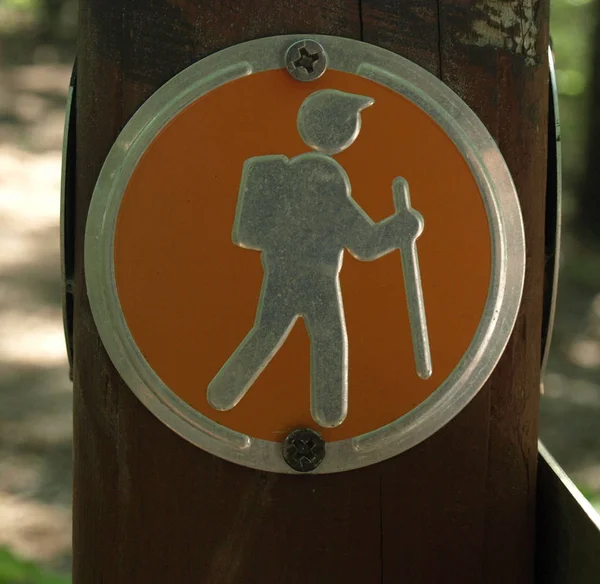 Hiking sign along a trail in the mountains