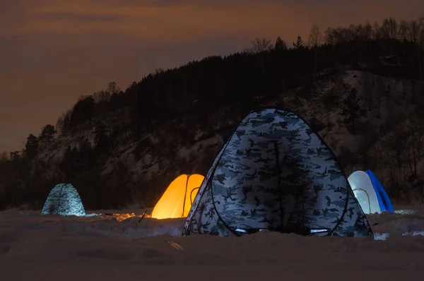 Winter fishing in the tent at night