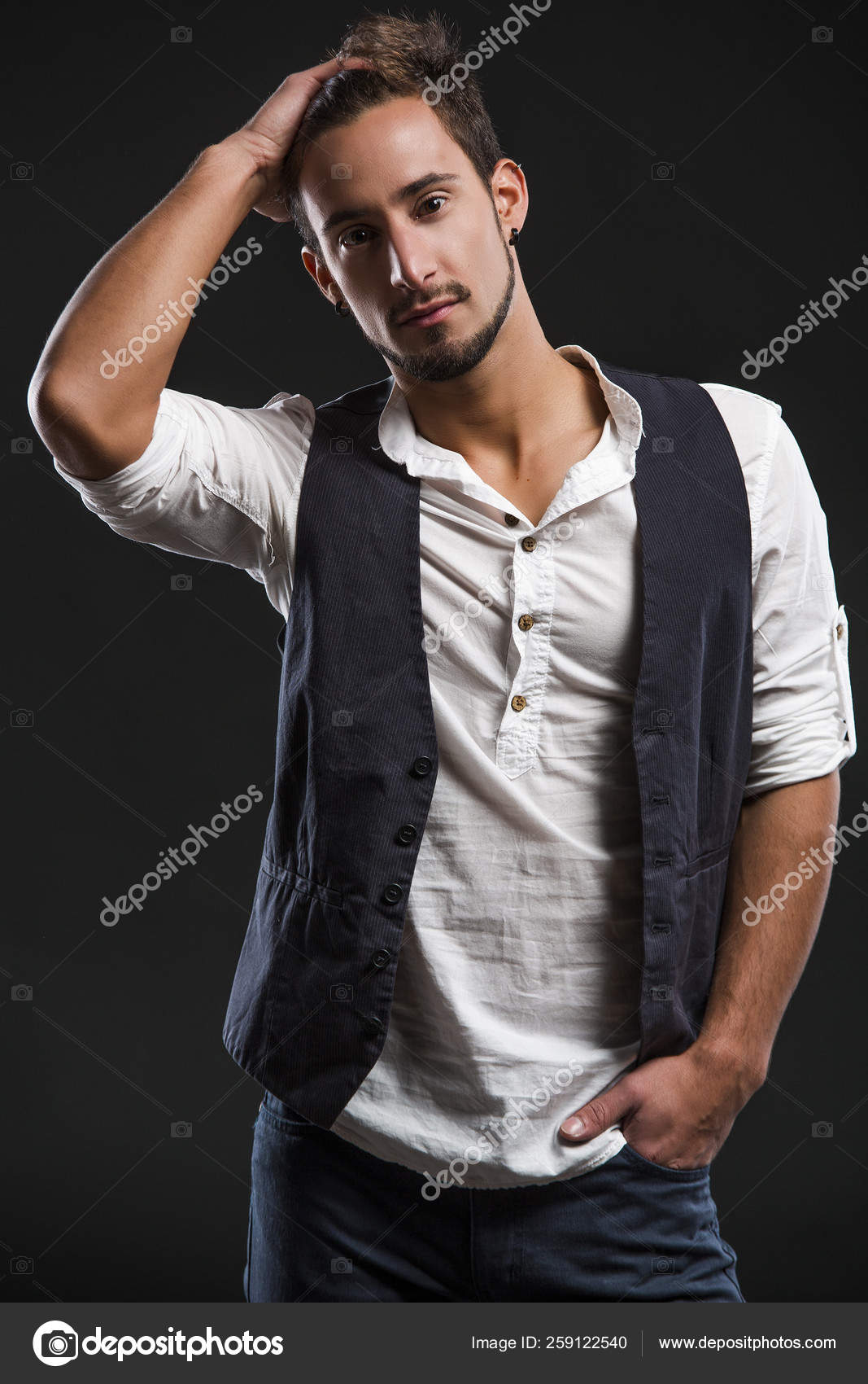 Full Length Portrait Of A Handsome Male Model In Black Clothes Posing At  Studio. Men's Beauty, Fashion. Stock Photo, Picture and Royalty Free Image.  Image 47283526.