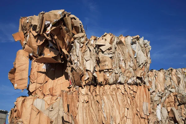 Stack of pressed paper at a recycling center