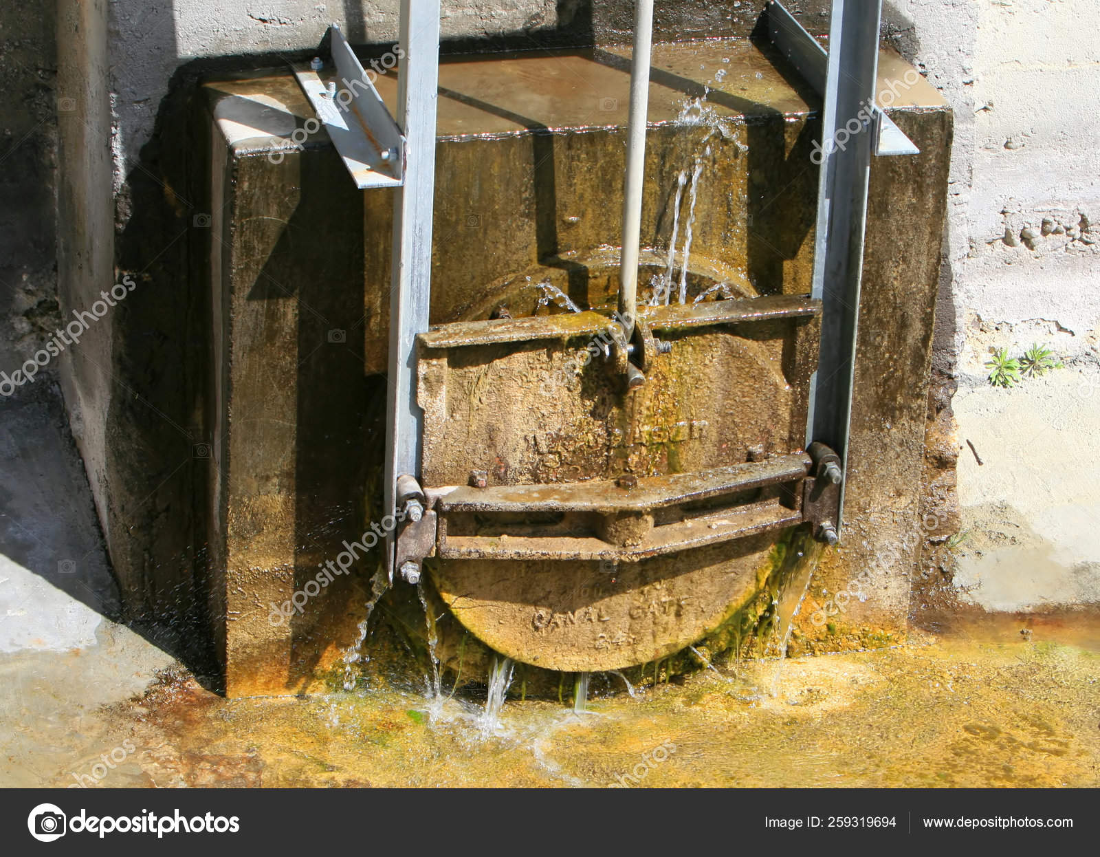 Leaking Canal Gate Holds Back Water — Stock Photo © YAYImages 259319694