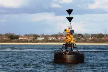 hamble point south cardinal marker floating in the solent clipart