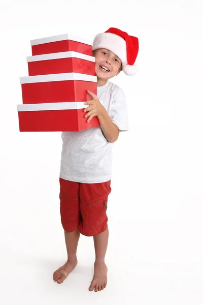 Junge Trägt Rot Weiße Geschenkboxen — Stockfoto