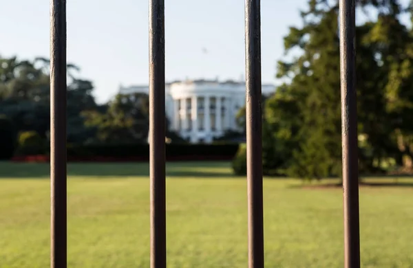 South Lawn view of White House seen through railings Washington DC