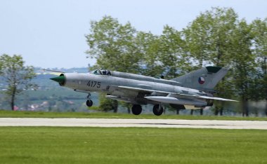 MiG-21 Fishbed landing at Caslav airbase during airshow clipart