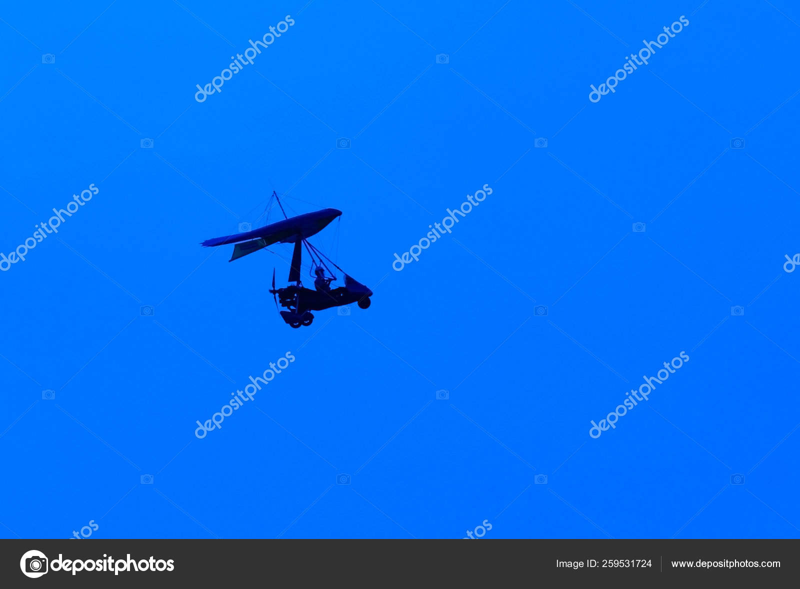 Silhouette Microlight Aircraft Blue Background Stock Photo by ...