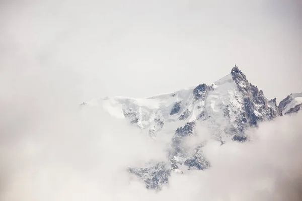 top of mountains in blue sky