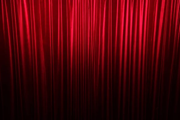 Large red stage curtain with light and shadow