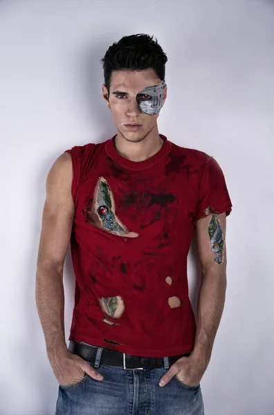 Attractive Young Man Robotic Skin Art Ripped Shirt Looking Camera — Stock fotografie
