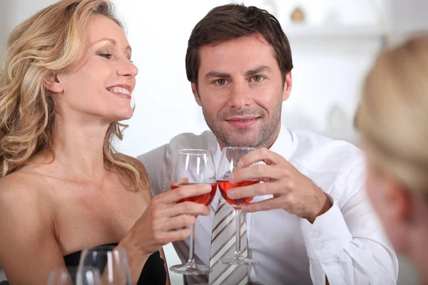 Couple Sitting Holding Wine Glasses Together — Stock Photo, Image