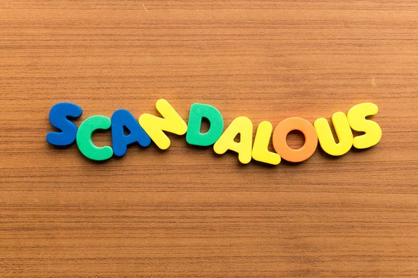 Scandalous Colorful Word Wooden Background — Stock Photo, Image