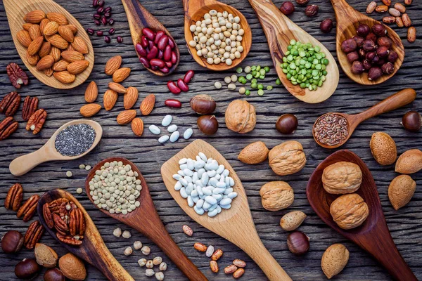 Various Legumes Different Kinds Nutshells Spoons Walnuts Kernels Hazelnuts Almond — Stock Photo, Image