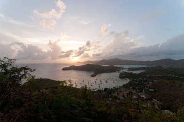 Looking down on English Harbour at sunset from Shirley Heights in Antigua clipart