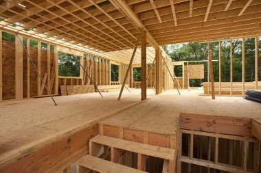 Interior framing of a new house under construction clipart