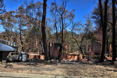 After the fire.   Bushfire destroys homes and vehicles in a random pattern while some are spared completely, others are razed to the ground. clipart