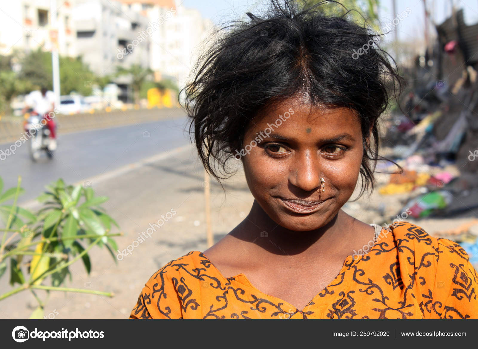 Portrait Anxious Looking Teenage Beggar Girl Streetside India Stock Photo  by ©YAYImages 259792020