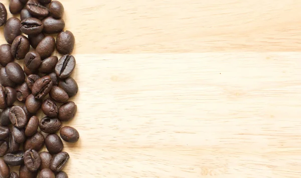 Coffee beans and Good morning note on the wooden desk