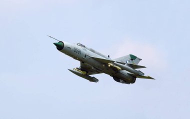 MiG-21 Fishbed fighter flying during Prague airshow clipart