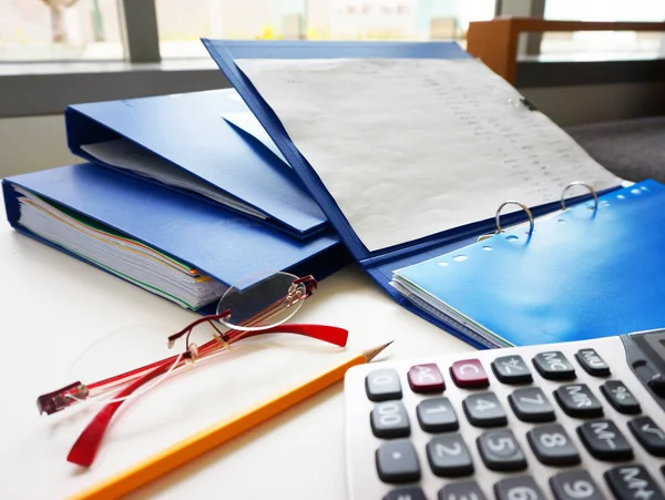 Blue Folders Other Office Equipment Calculators Pencil Glasses Placed Desk — Stock Photo, Image