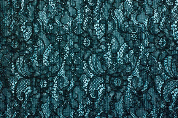 Black openwork lace background texture. Black guipure. Black fabric with ornament. Background from black lace with pattern with form flower